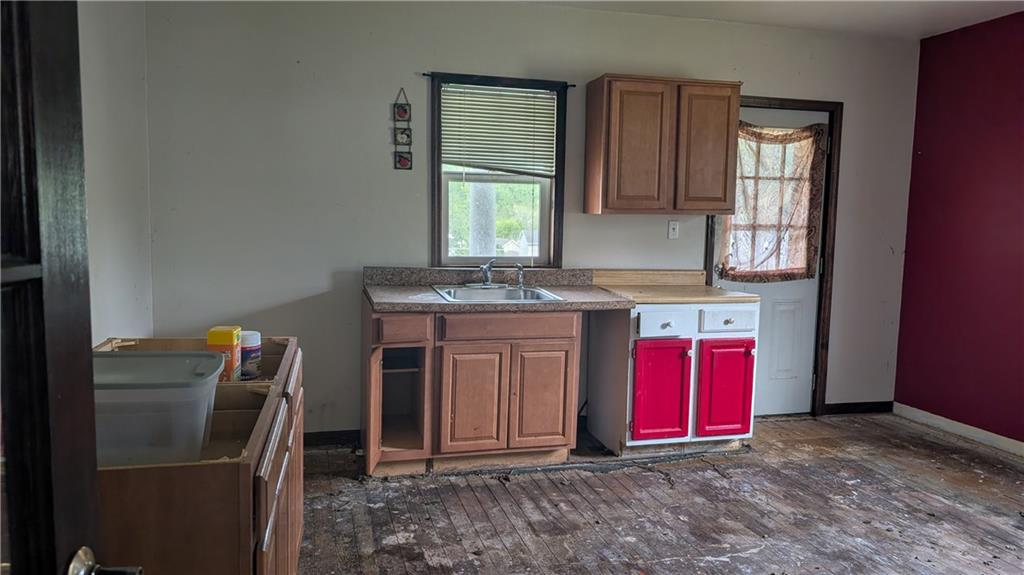 102 Moose Hill Road Millsboro, PA 15348 - Photo 7 of 11 a view of a kitchen with stainless steel appliances granite countertop a stove a refrigerator and a microwave