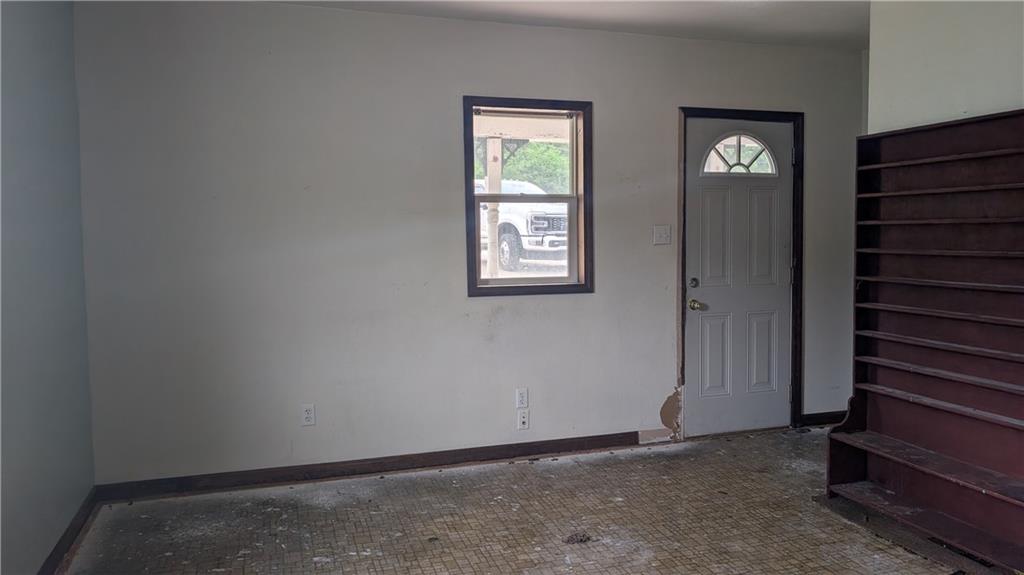 102 Moose Hill Road Millsboro, PA 15348 - Photo 8 of 11 a view of an empty room with wooden floor and a window