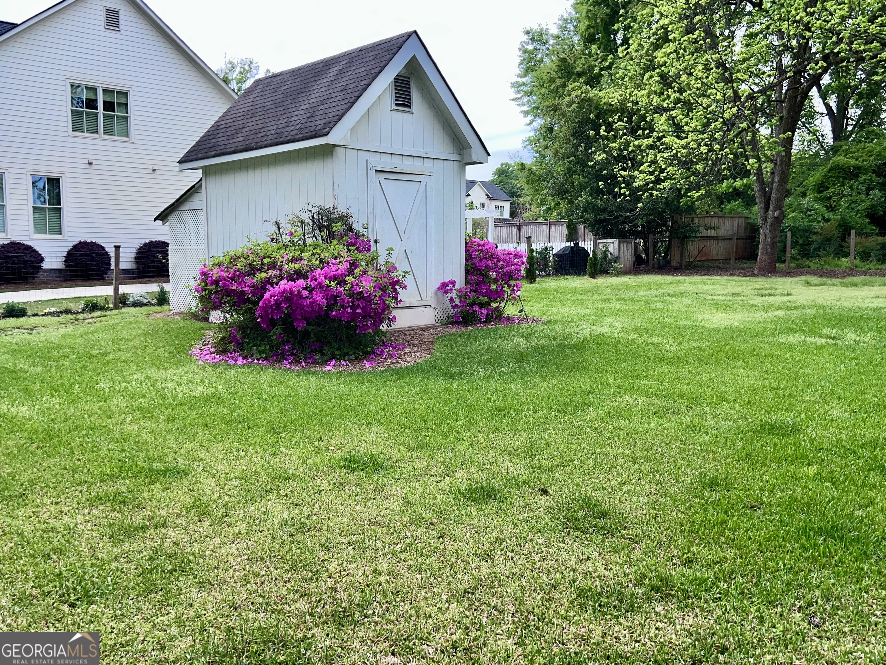 600 Foster Street Madison, GA 30650 - Photo 51 of 54 a front view of house with yard and green space