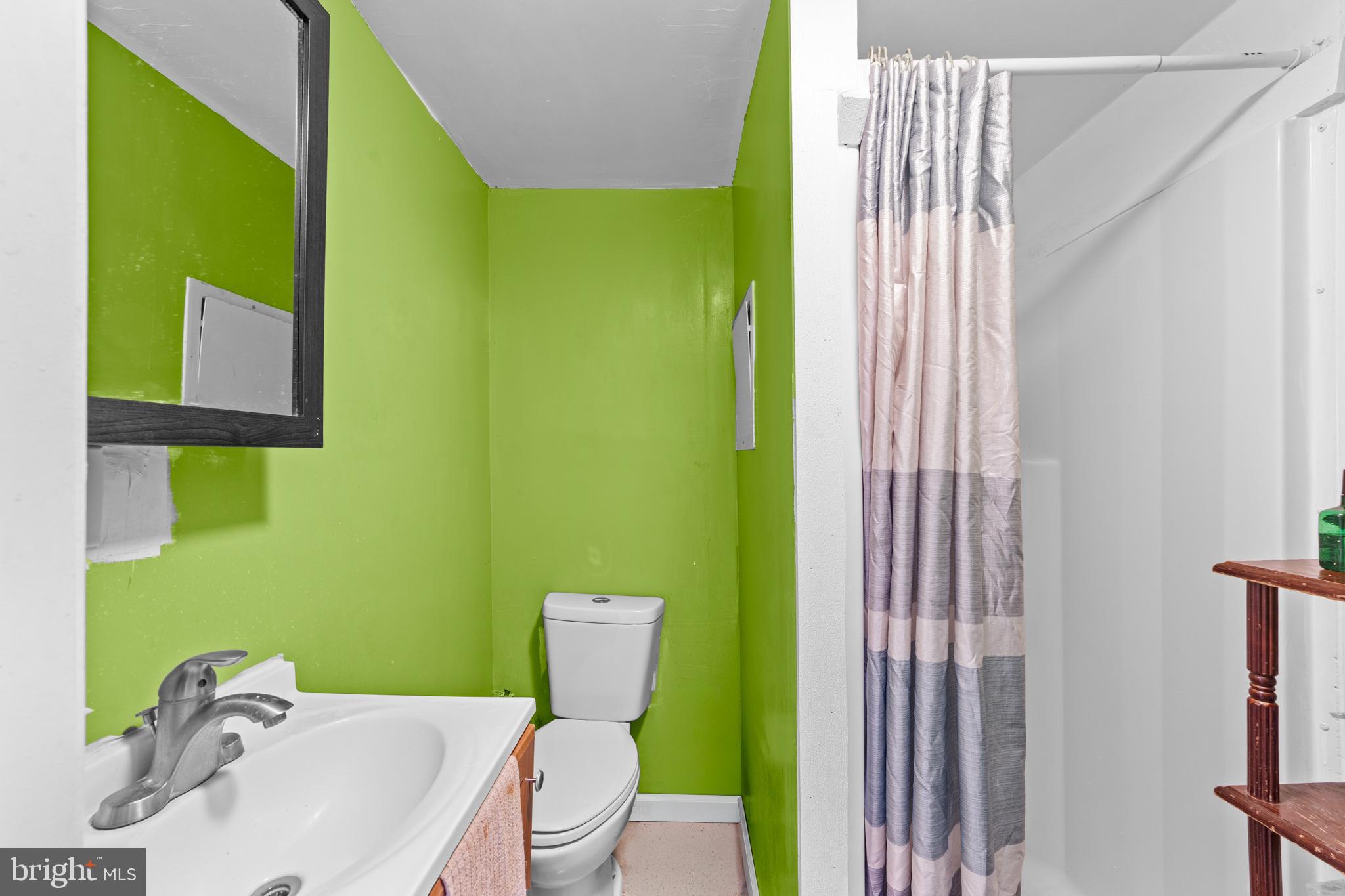 1314 Farrington Road Philadelphia, PA 19151 - Photo 19 of 21 a bathroom with a sink toilet and shower