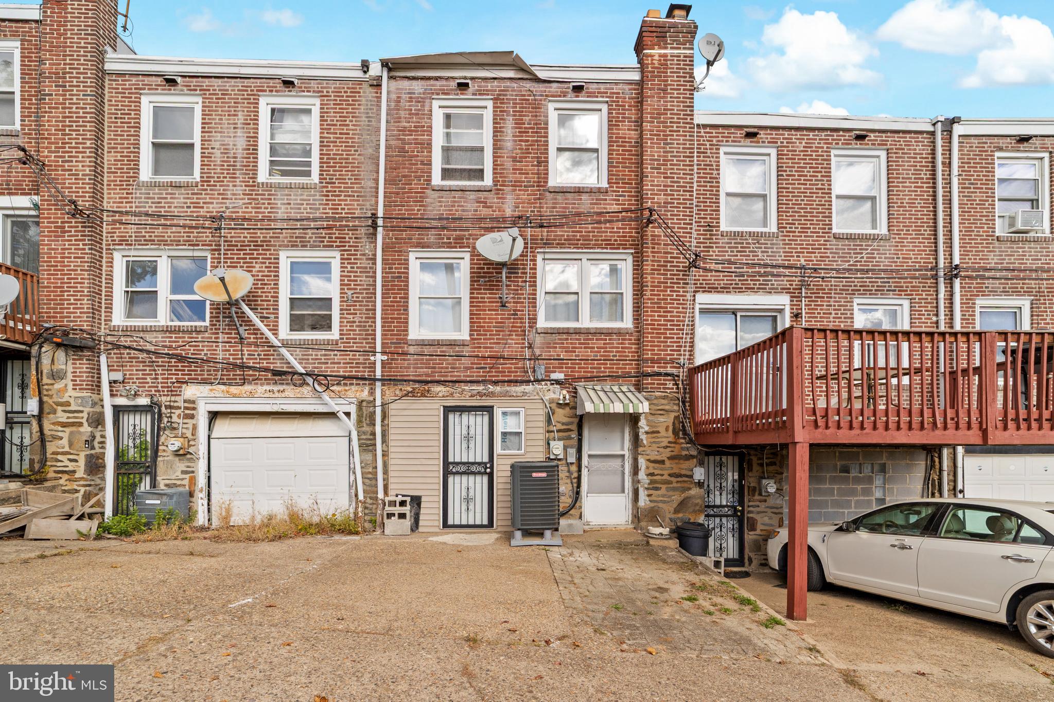 1314 Farrington Road Philadelphia, PA 19151 - Photo 20 of 21 front view of a brick house with a street