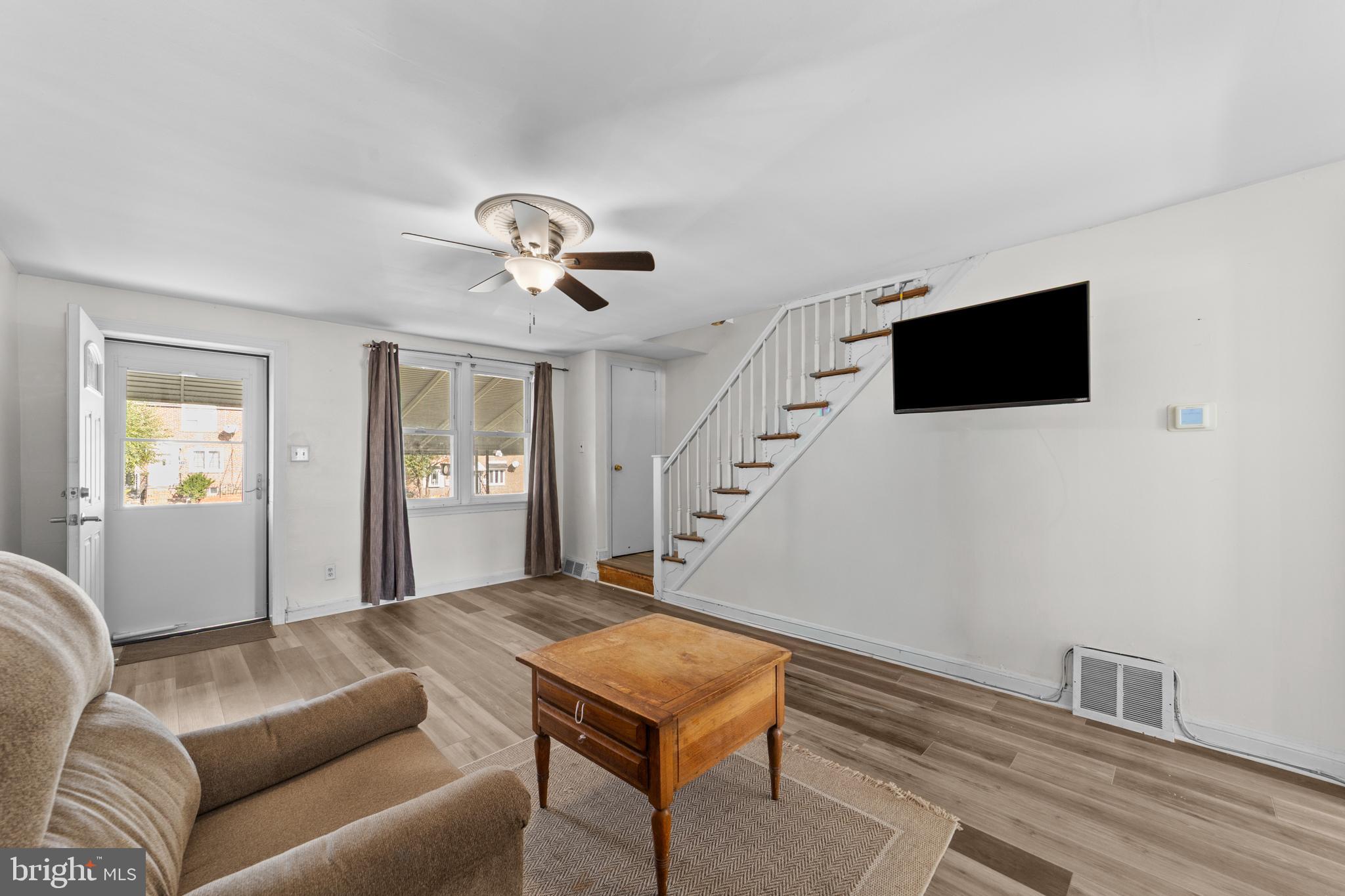 1314 Farrington Road Philadelphia, PA 19151 - Photo 2 of 21 a living room with furniture and a flat screen tv