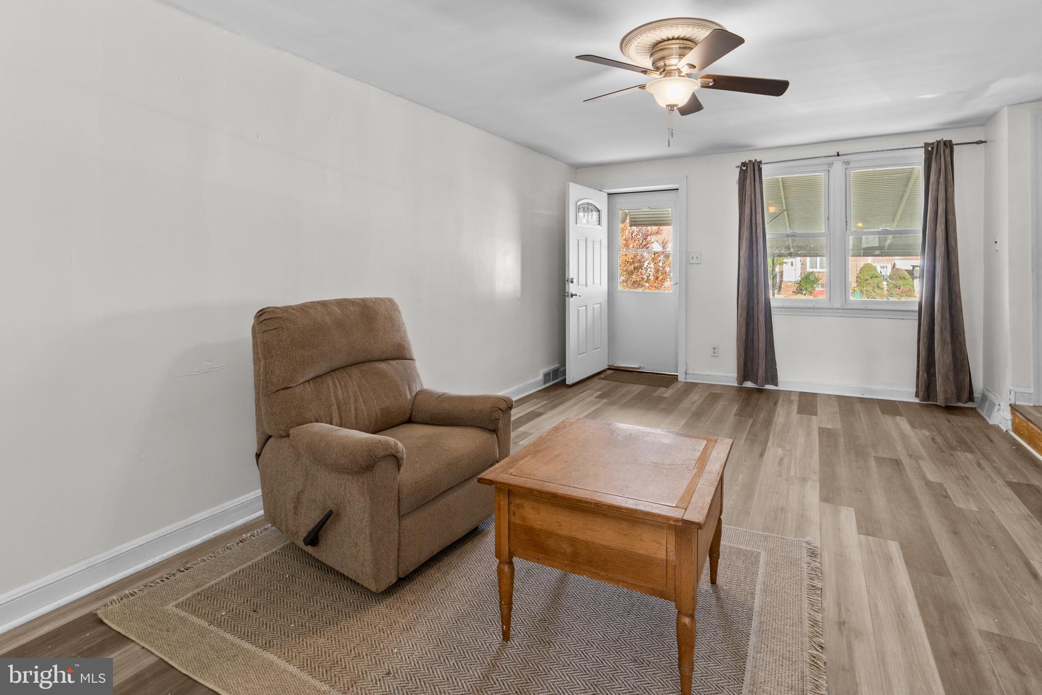 1314 Farrington Road Philadelphia, PA 19151 - Photo 3 of 21 a living room with furniture and a window