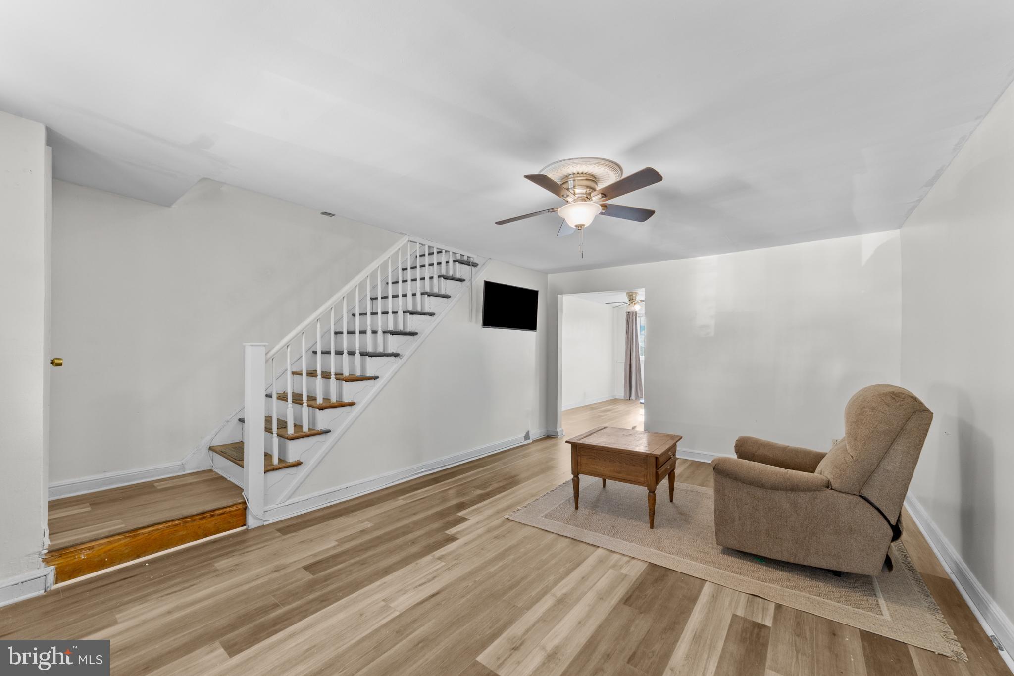 1314 Farrington Road Philadelphia, PA 19151 - Photo 4 of 21 a living room with furniture and a chandelier