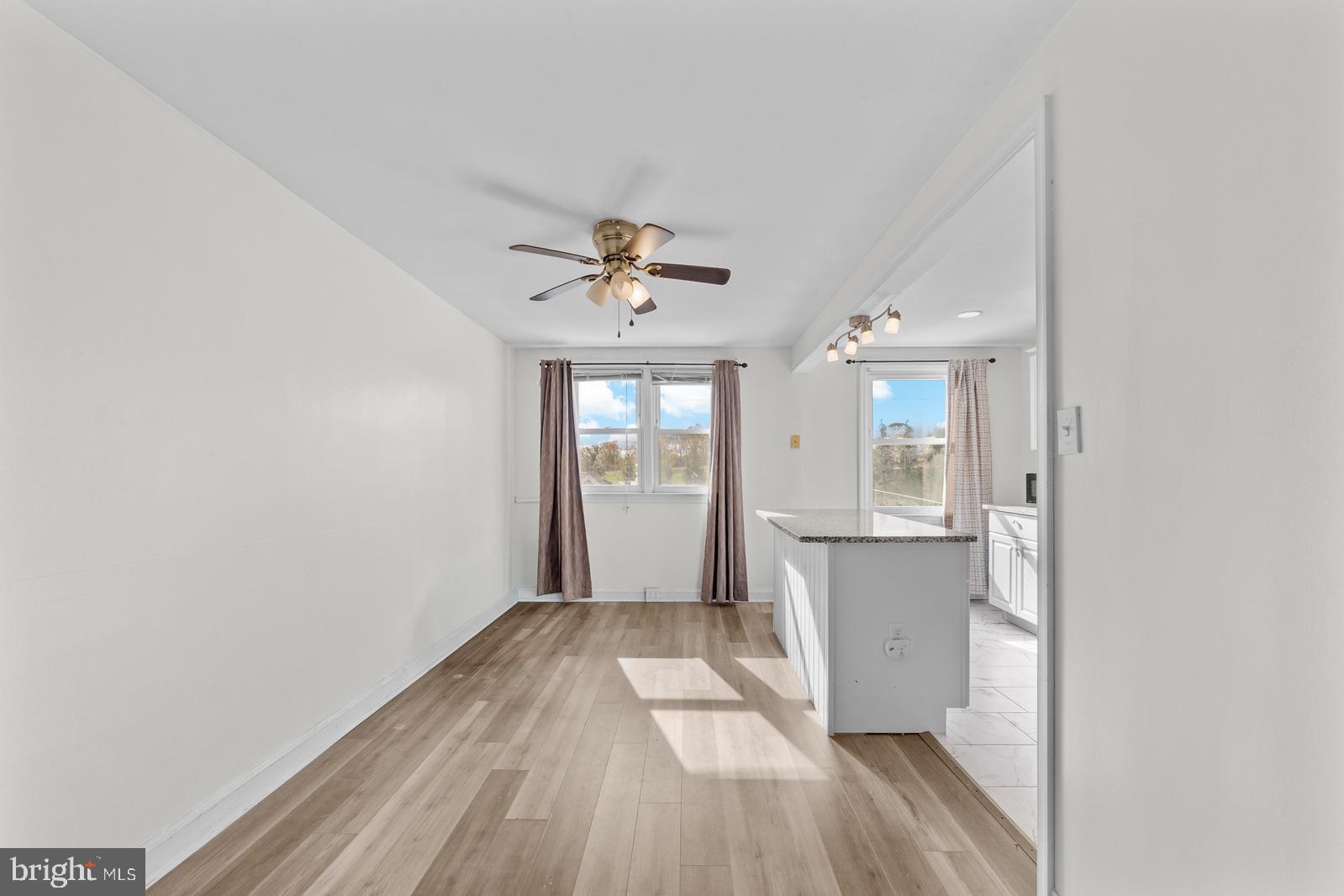 1314 Farrington Road Philadelphia, PA 19151 - Photo 5 of 21 wooden floor in an empty room with a window