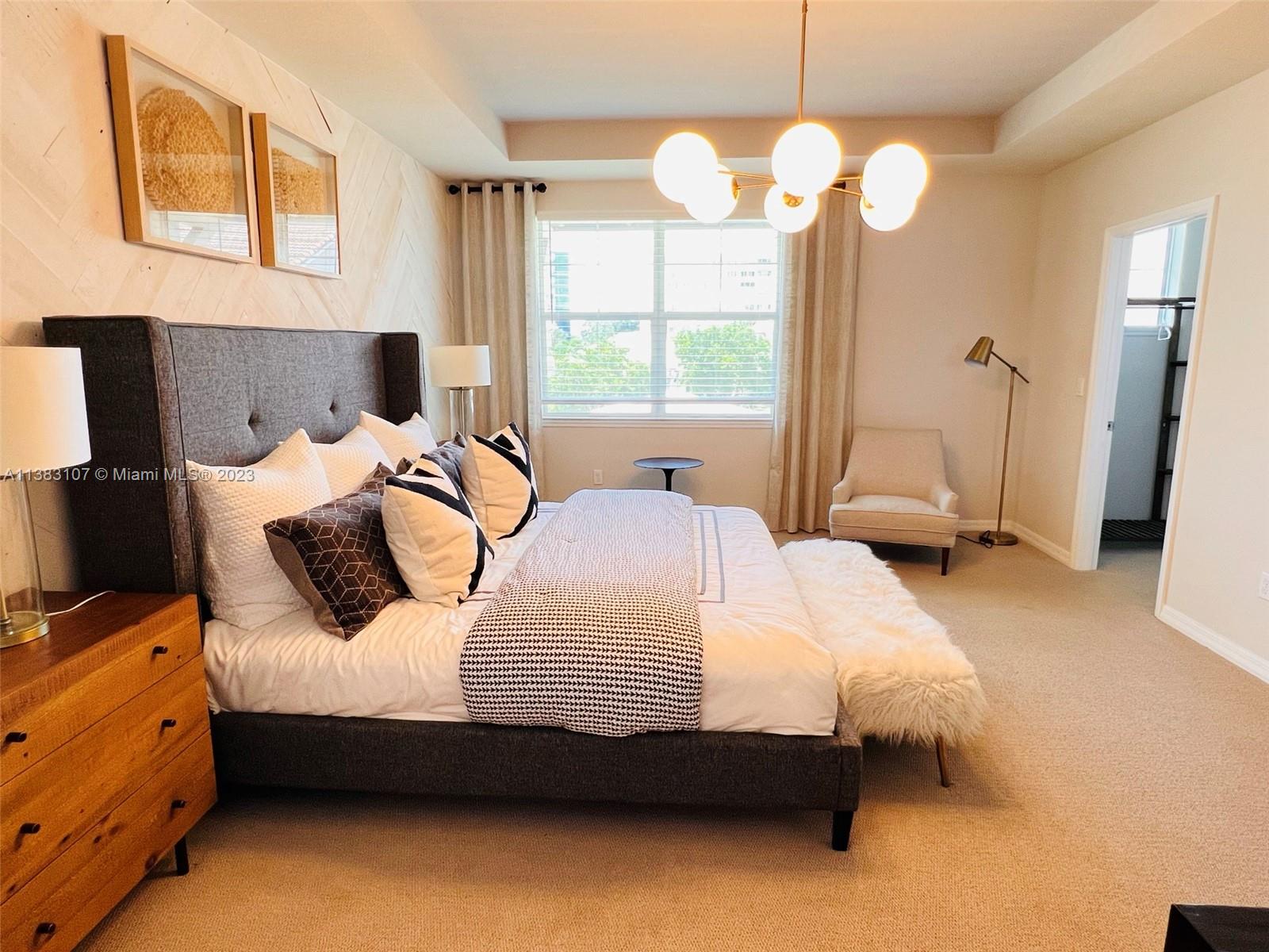 4002 Long Leaf Lane, Unit 6 Hollywood, FL 33021 - Photo 11 of 35 a bedroom with bed and window