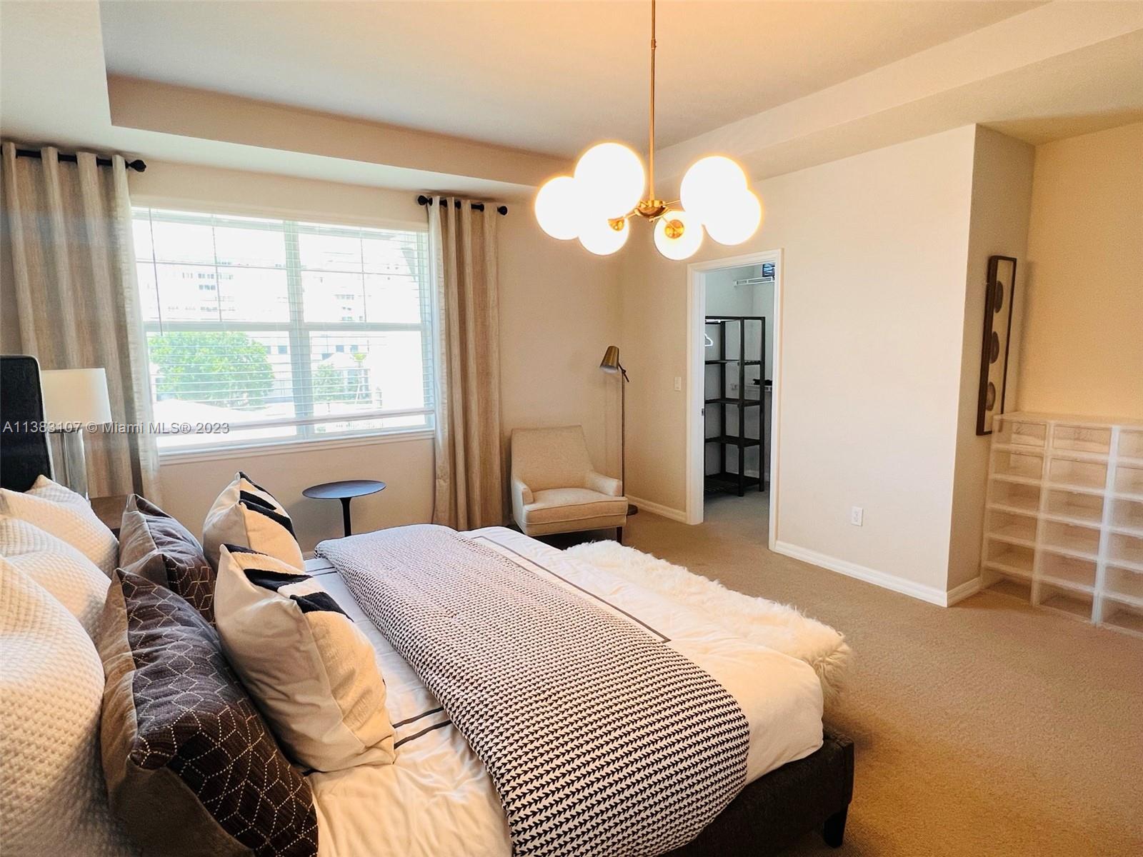 4002 Long Leaf Lane, Unit 6 Hollywood, FL 33021 - Photo 12 of 35 a bedroom with a bed and a window