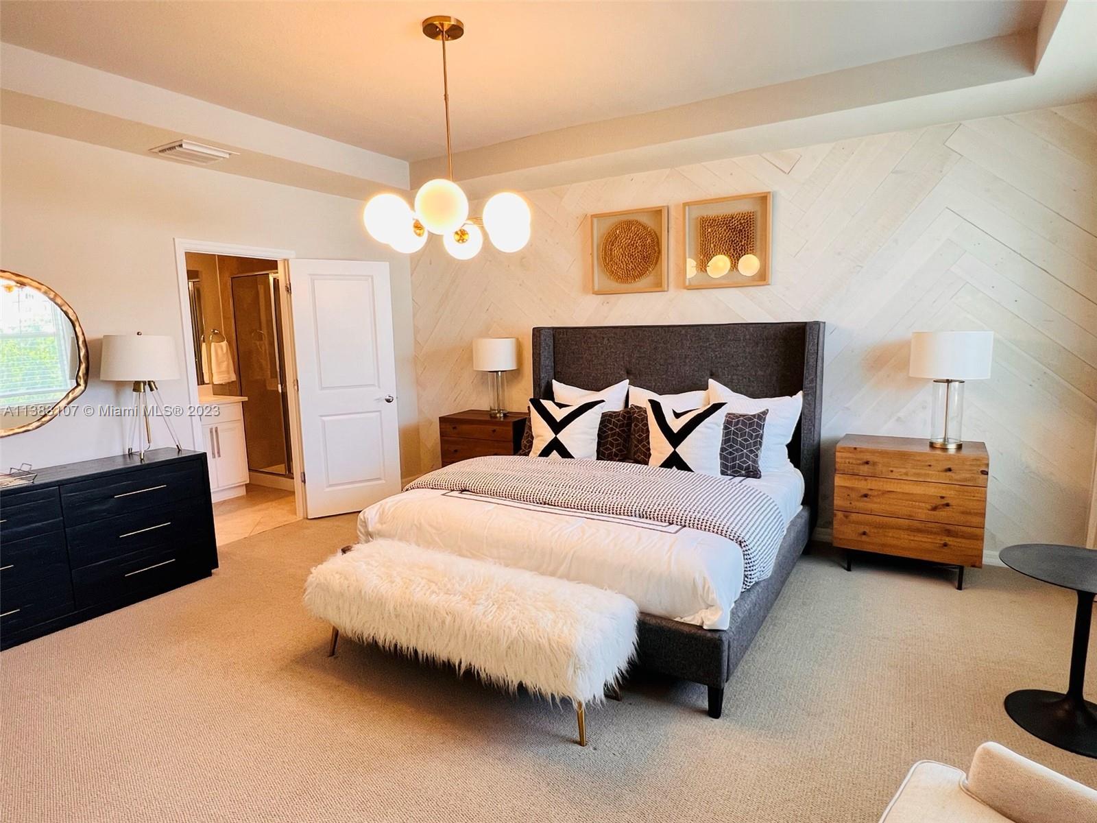 4002 Long Leaf Lane, Unit 6 Hollywood, FL 33021 - Photo 13 of 35 a bedroom with bed and wooden floor