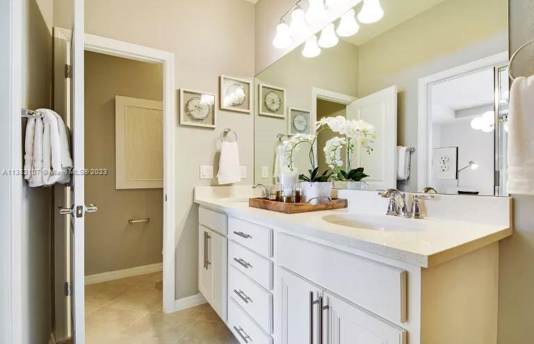 4002 Long Leaf Lane, Unit 6 Hollywood, FL 33021 - Photo 15 of 35 a bathroom with a sink vanity and a mirror