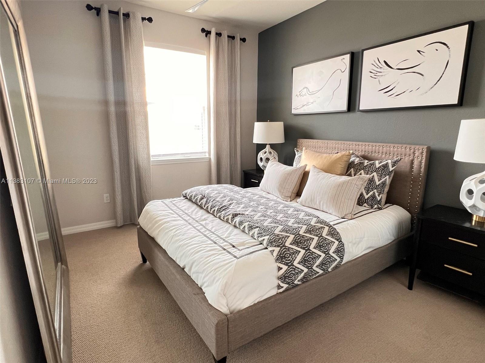 4002 Long Leaf Lane, Unit 6 Hollywood, FL 33021 - Photo 19 of 35 a bedroom with a bed and window