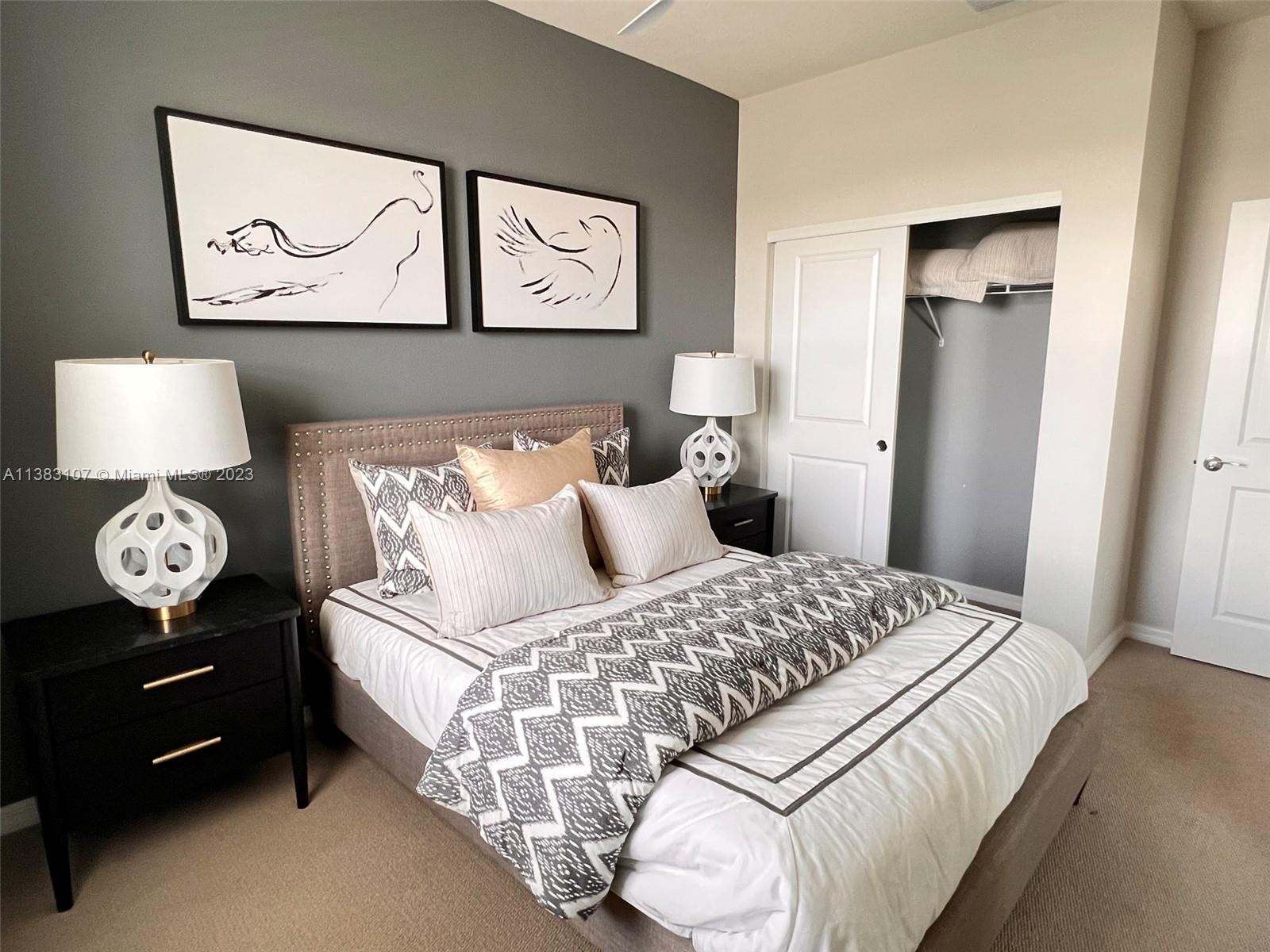 4002 Long Leaf Lane, Unit 6 Hollywood, FL 33021 - Photo 20 of 35 a bedroom with a bed and painting on the wall