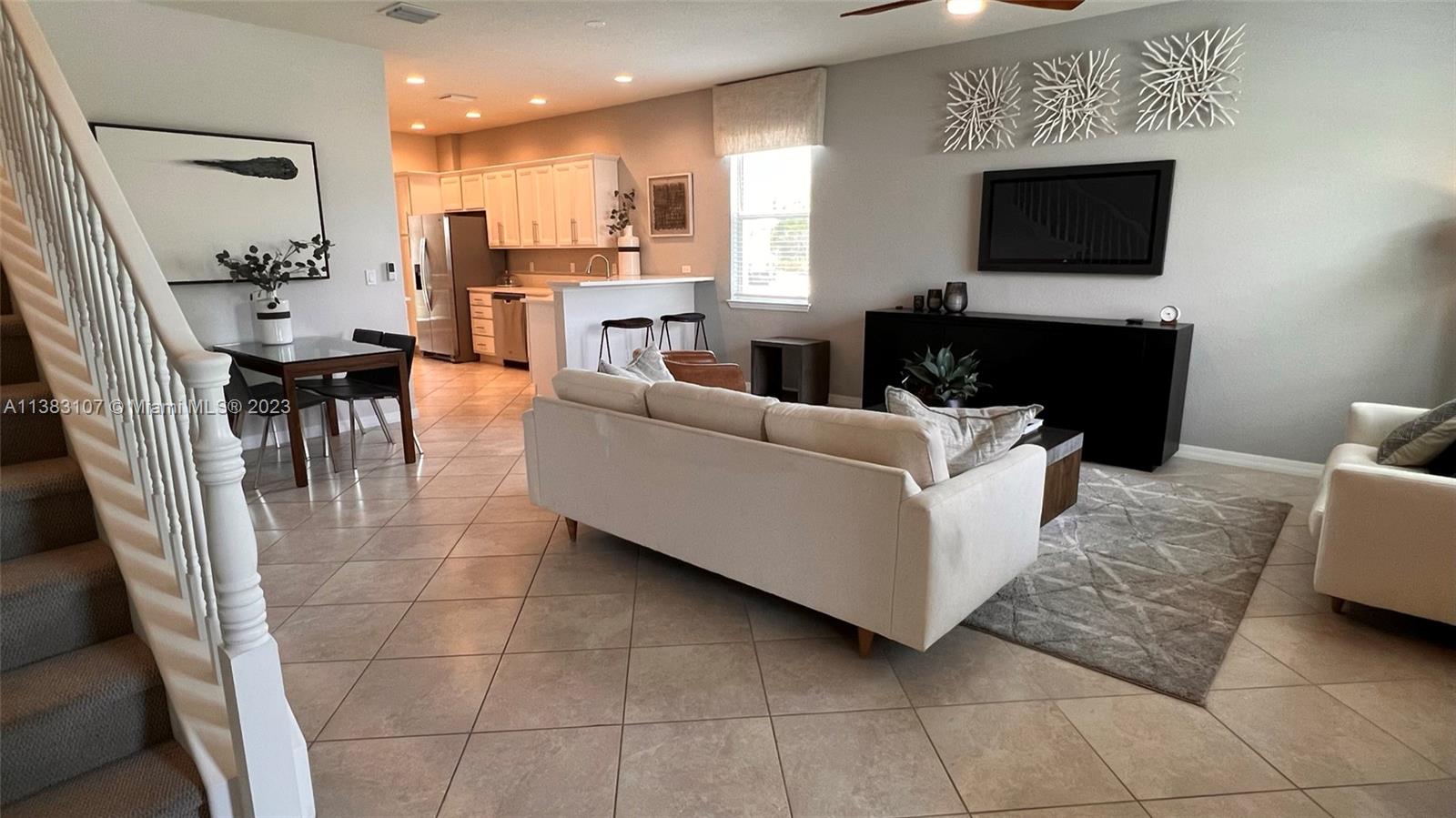 4002 Long Leaf Lane, Unit 6 Hollywood, FL 33021 - Photo 2 of 35 a living room with furniture and a flat screen tv