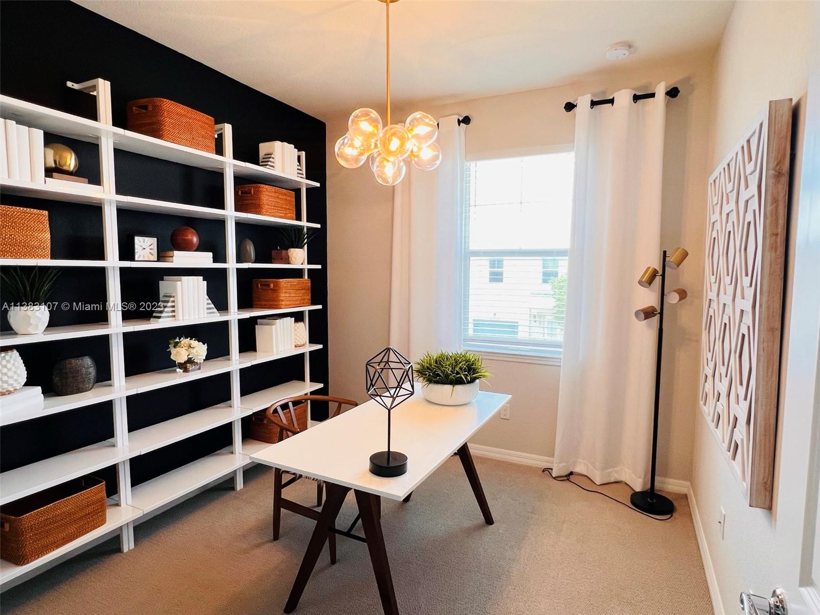 4002 Long Leaf Lane, Unit 6 Hollywood, FL 33021 - Photo 22 of 35 a view of a room with furniture and a chandelier