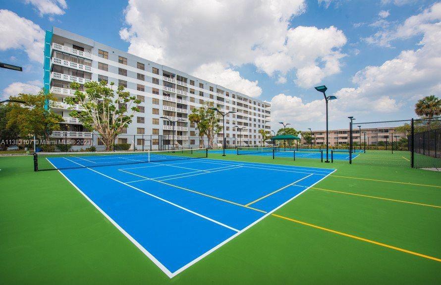 4002 Long Leaf Lane, Unit 6 Hollywood, FL 33021 - Photo 30 of 35 a view of a tennis court