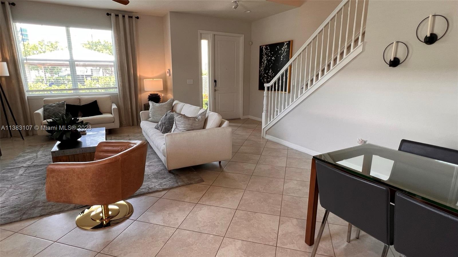 4002 Long Leaf Lane, Unit 6 Hollywood, FL 33021 - Photo 4 of 35 a living room with furniture and a window