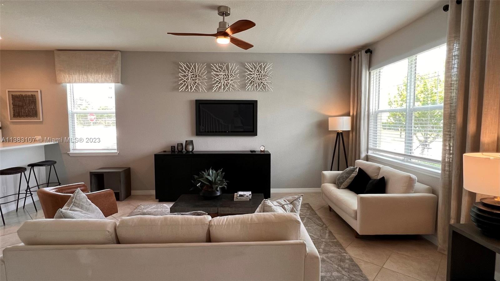 4002 Long Leaf Lane, Unit 6 Hollywood, FL 33021 - Photo 5 of 35 a living room with furniture a flat screen tv and a fireplace