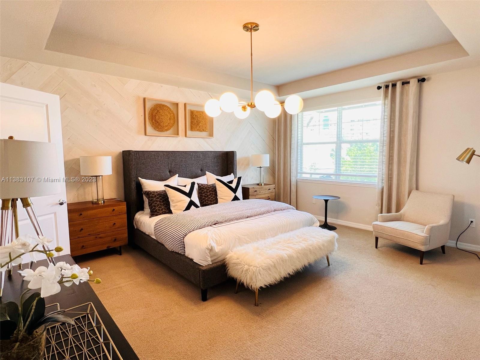 4002 Long Leaf Lane, Unit 6 Hollywood, FL 33021 - Photo 10 of 35 a bedroom with bed and wooden floor