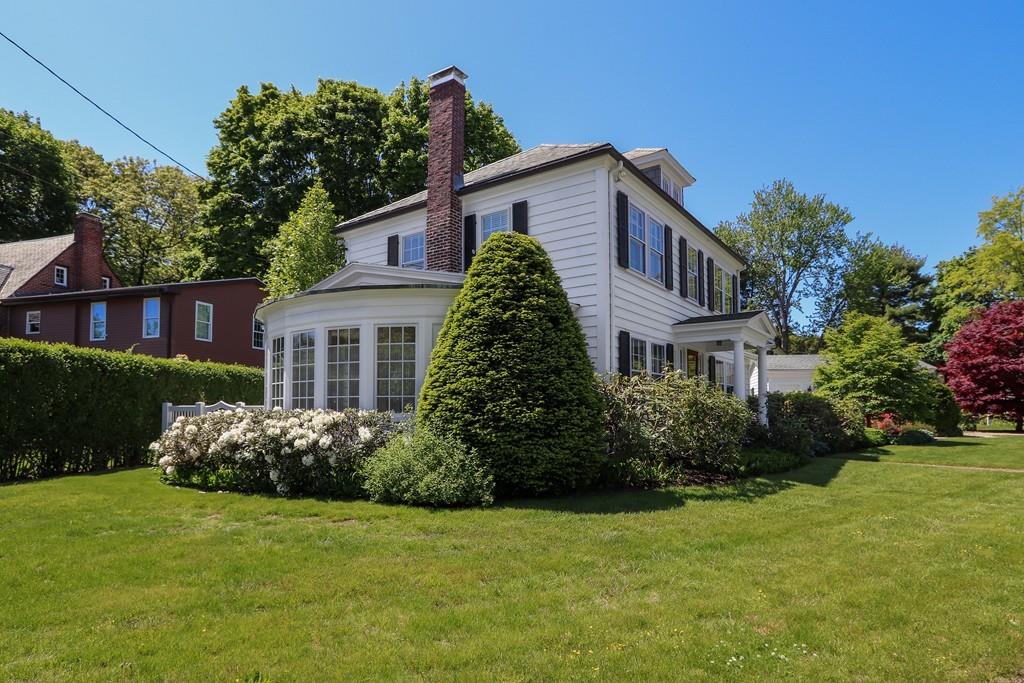 8 Varick Road Newton, MA 02468 - Photo 2 of 42 a front view of a house with garden