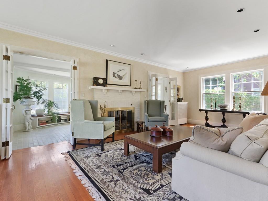 8 Varick Road Newton, MA 02468 - Photo 22 of 42 a living room with fireplace furniture and a large window