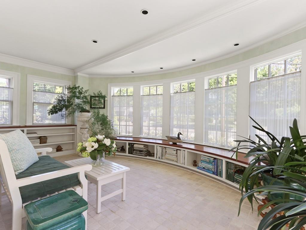 8 Varick Road Newton, MA 02468 - Photo 23 of 42 a living room with furniture potted plant and a large window