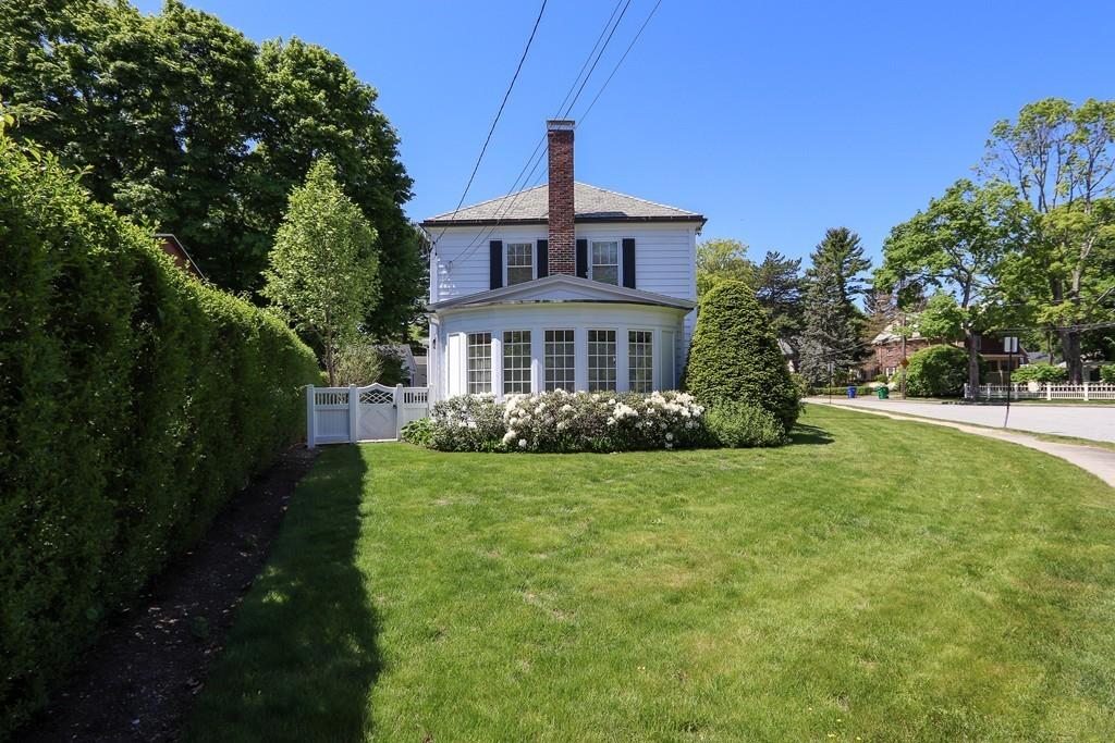8 Varick Road Newton, MA 02468 - Photo 3 of 42 a front view of a house with a yard