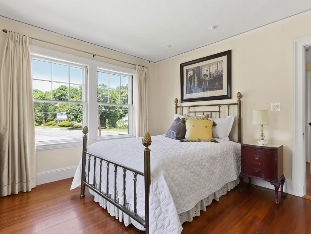 8 Varick Road Newton, MA 02468 - Photo 31 of 42 a bedroom with a bed and wooden floor