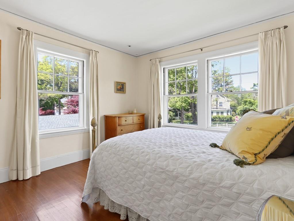 8 Varick Road Newton, MA 02468 - Photo 32 of 42 a bedroom with a bed and wooden floor