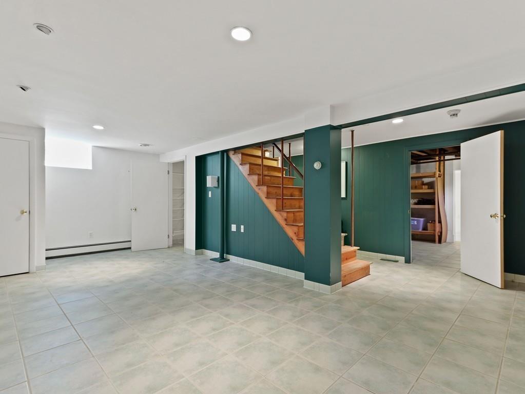 8 Varick Road Newton, MA 02468 - Photo 37 of 42 an empty room with closet and a large window