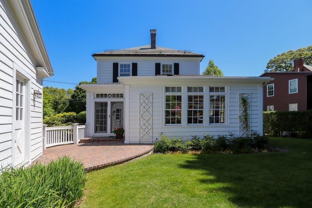 8 Varick Road Newton, MA 02468 - Photo 40 of 42 a front view of a house with a yard