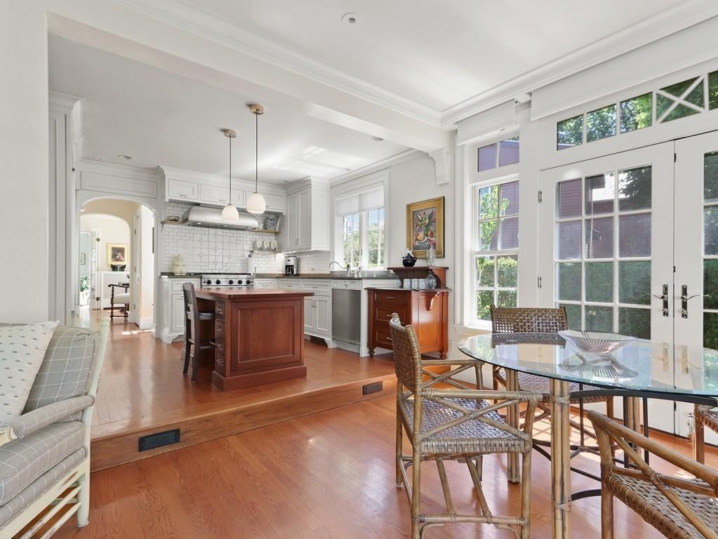 8 Varick Road Newton, MA 02468 - Photo 8 of 42 a living room with furniture and kitchen view