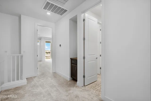 an empty room with closet area