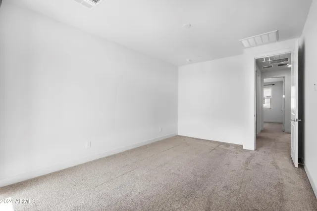 a view of an empty room and closet
