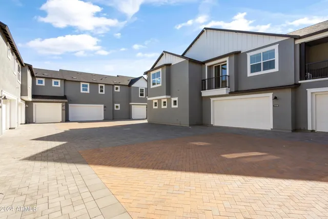 a front view of a house with a garage