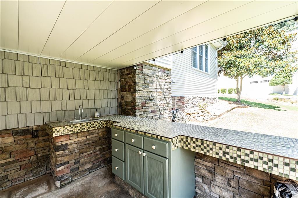 113 Warwick Way Rome, GA 30161 - Photo 50 of 50 a bathroom with a granite countertop sink and a mirror