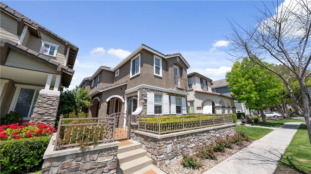 5 Second Street Ladera Ranch, CA 92694 - Photo 2 of 36 a front view of a house with a garden