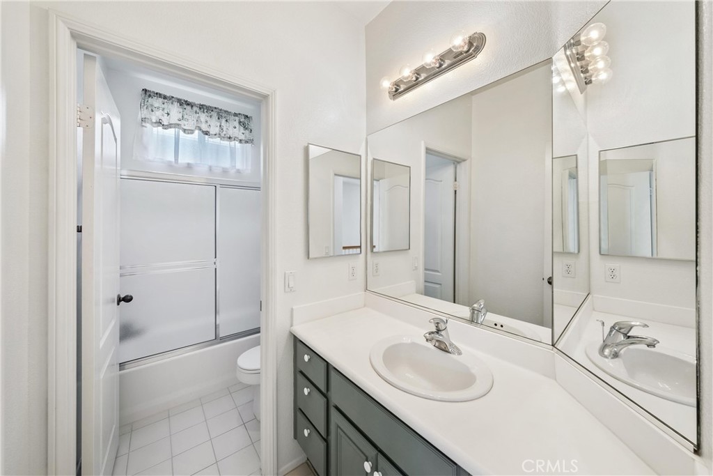 5 Second Street Ladera Ranch, CA 92694 - Photo 21 of 36 a bathroom with a sink a toilet and shower