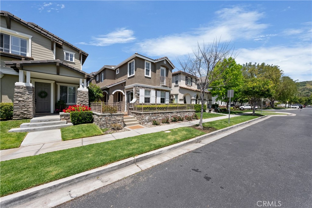 5 Second Street Ladera Ranch, CA 92694 - Photo 3 of 36 a front view of a house with a yard and potted plants