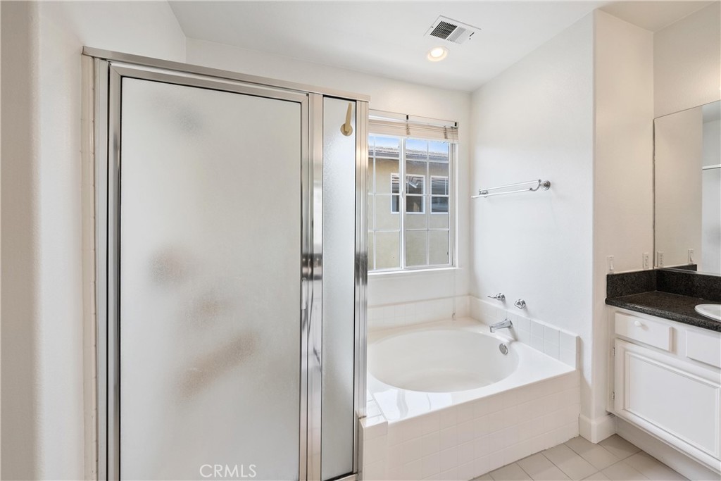 5 Second Street Ladera Ranch, CA 92694 - Photo 31 of 36 a bathroom with a bathtub and a sink