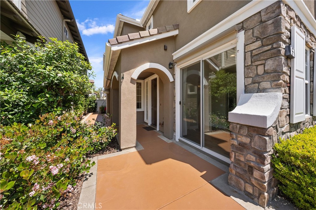 5 Second Street Ladera Ranch, CA 92694 - Photo 5 of 36 a front view of a house with garden