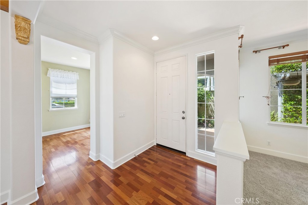 5 Second Street Ladera Ranch, CA 92694 - Photo 8 of 36 an empty room with wooden floor and windows