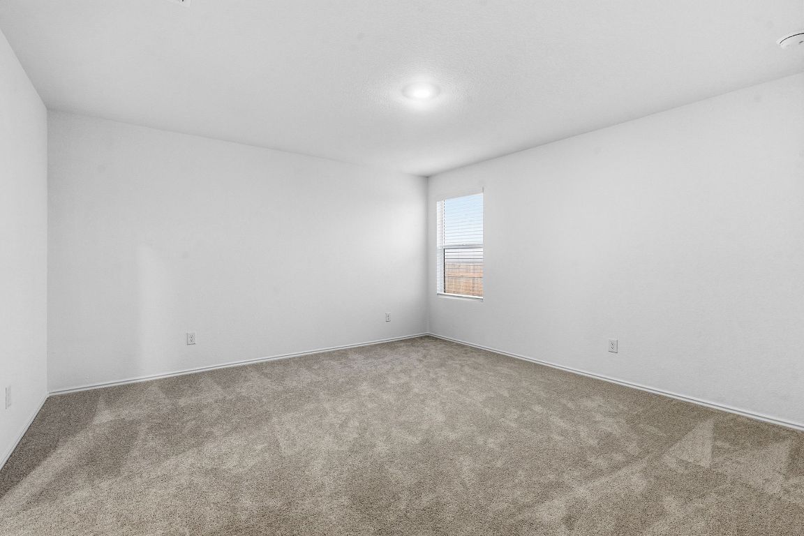 511 Paris Street Maxwell, TX 78656 - Photo 14 of 27 an empty room with a window