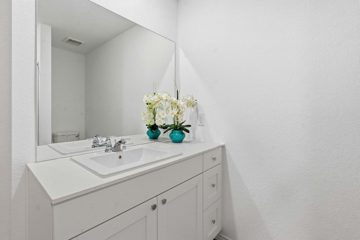 511 Paris Street Maxwell, TX 78656 - Photo 18 of 27 a bathroom with a sink and a mirror