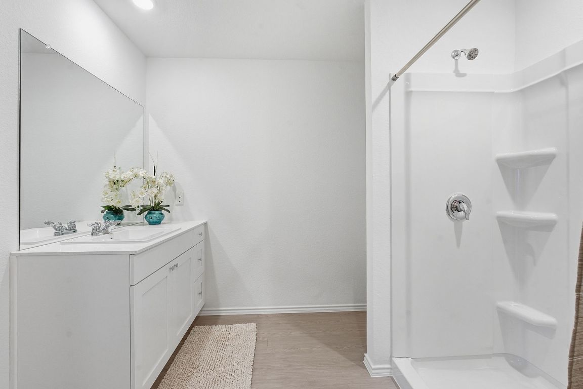 511 Paris Street Maxwell, TX 78656 - Photo 19 of 27 a bathroom with a sink a toilet and shower