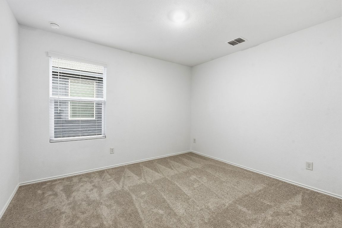 511 Paris Street Maxwell, TX 78656 - Photo 21 of 27 an empty room with a window
