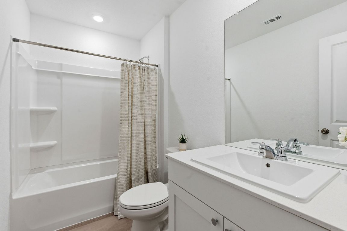 511 Paris Street Maxwell, TX 78656 - Photo 22 of 27 a bathroom with a sink toilet and shower