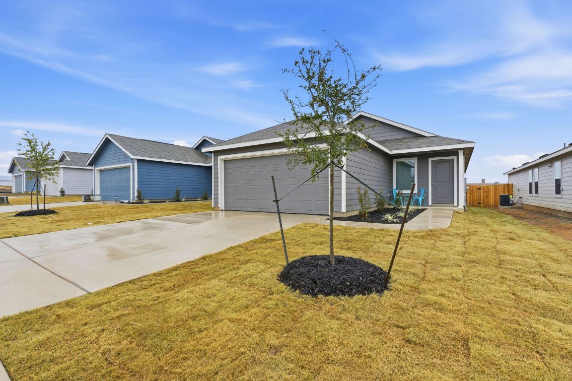 511 Paris Street Maxwell, TX 78656 - Photo 4 of 27 a swimming pool with some trees in the background