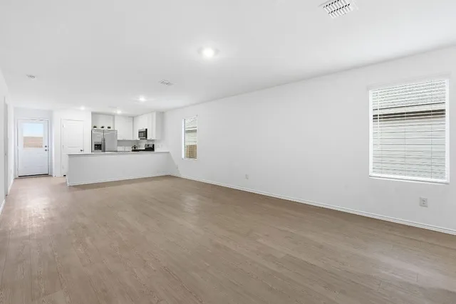 a view of a kitchen with a sink and a window