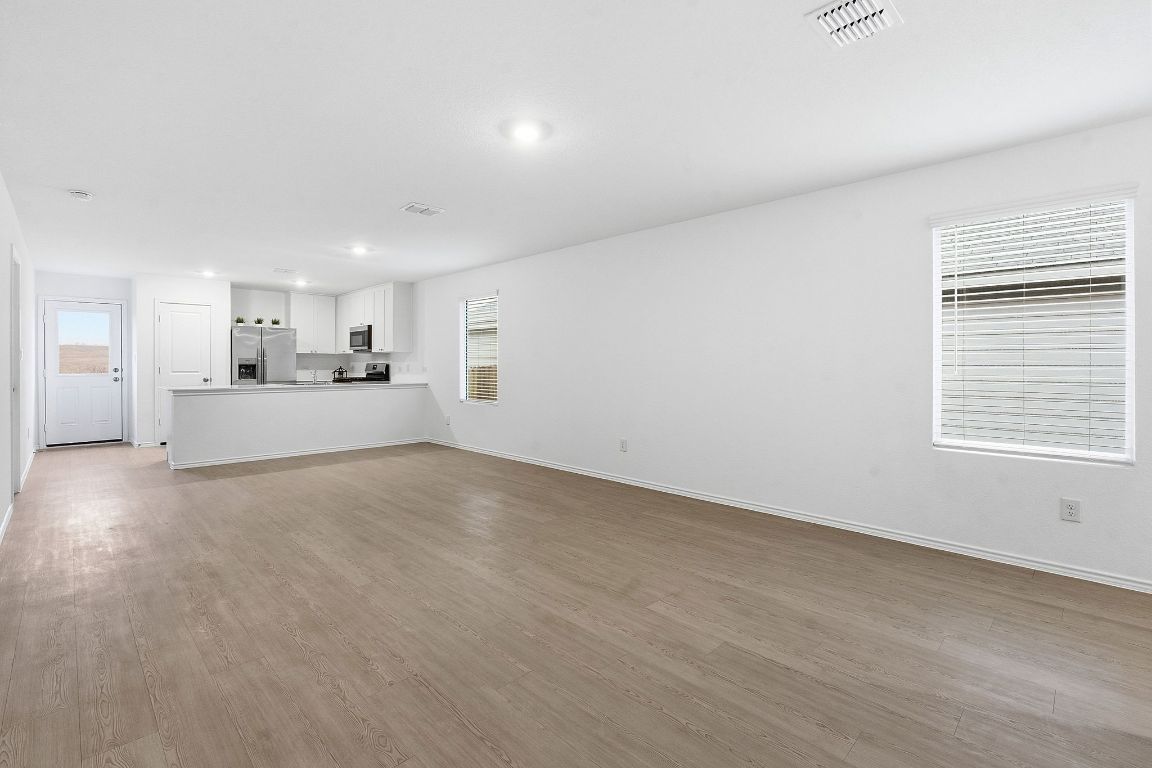 511 Paris Street Maxwell, TX 78656 - Photo 8 of 27 a view of a kitchen with a sink and a window