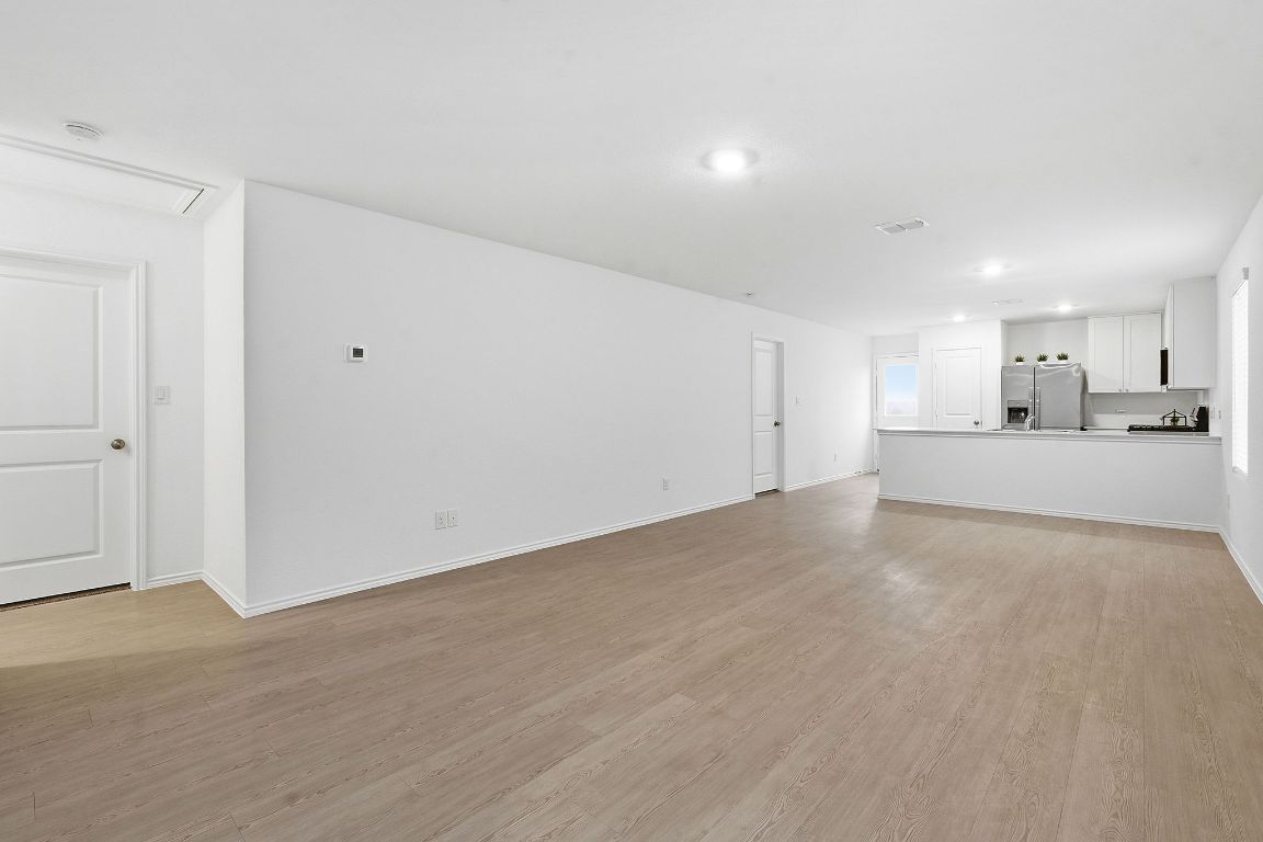 511 Paris Street Maxwell, TX 78656 - Photo 9 of 27 a view of a kitchen with a sink and a refrigerator