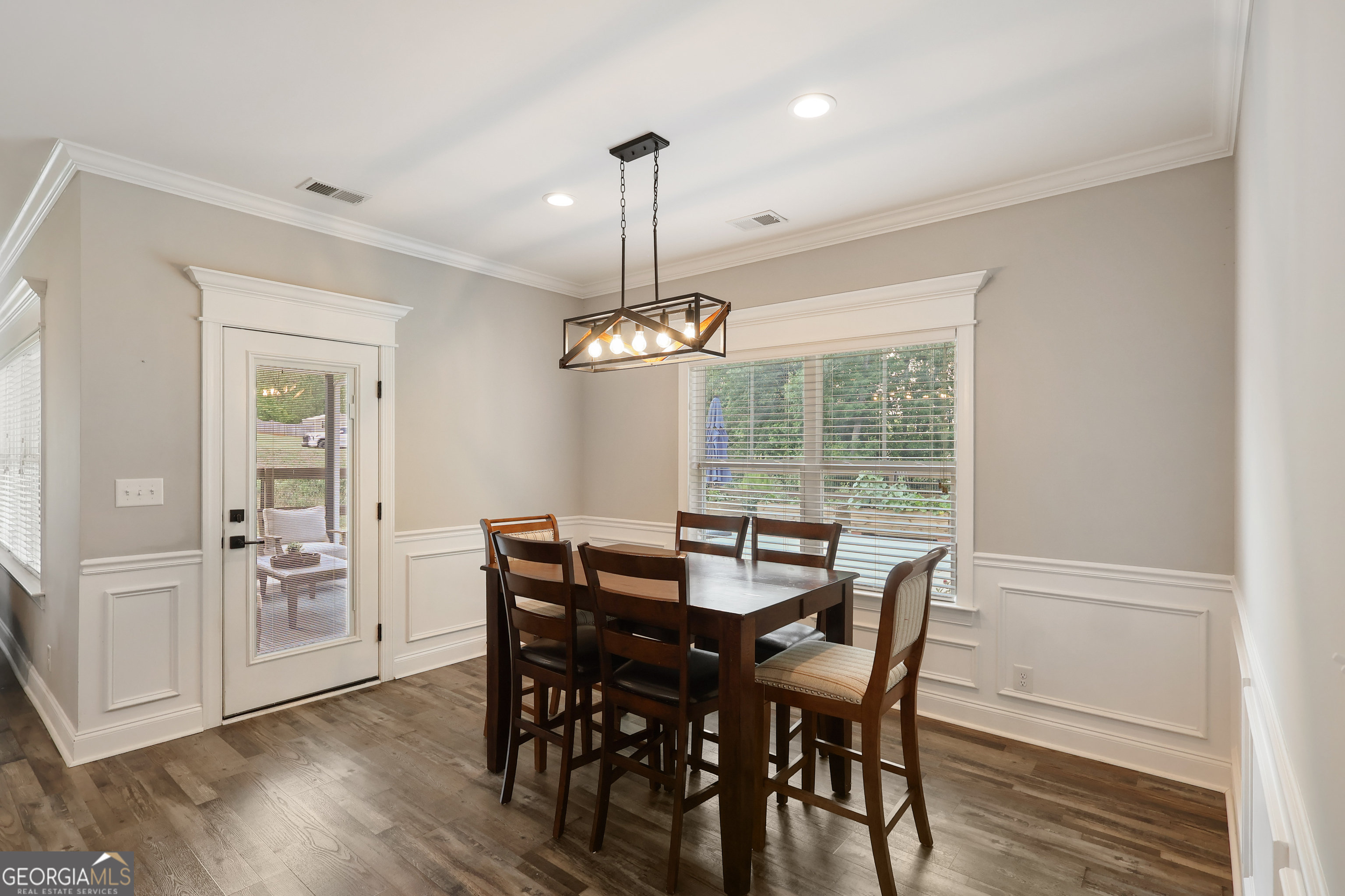 89 Claire Road Forsyth, GA 31029 - Photo 17 of 40 a view of a dining room with furniture window and wooden floor